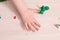 a small child sculpts from plasticine on a wooden table, the development of fine motor skills of hands