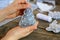 Small child shows a Christmas toy. Child holds a Christmas toy in his hands. Child sewed a Christmas tree ornament from felt