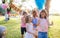 Small children outdoors in garden in summer, playing.