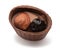Small chocolate basket with cream, prune and nut