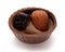 Small chocolate basket with cream, prune and nut