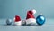 Small Christmas hat and ornament balls with blue background.Christmas concept with copy space