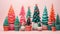 Small Christmas trees in colorful flowerpots.