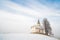 Small church on snowy hill. Slovenia