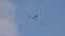 small civil aircraft in sky. Double seat plane flies forward in cloudy sky. agricultural air vehicle carrying employee