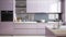 Small clean bright kitchen with purple kitchenette. modern kitchen interior. color blocking. lilac