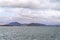 Small Coastal Town Viewed From the Ocean On A Dull Cloudy Day