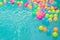 Small colorful beach balls floating in swimming pool abstract concept for pool party.