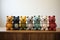 Small colorful crocheted toy bears in a row in a room on a wooden table. Child and eco Friendly sustainable Toy