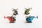 Small colorful helicopter toys isolated on a white background - air travel by helicopter concept