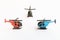 Small colorful helicopter toys isolated on a white background - air travel by helicopter concept