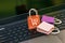 Small and colorful paper shopping bags on a laptop keyboard. Ideas about online shopping or shopping at home or office which