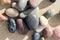 Small colorful pebbles background, simplicity, daylight, stones, white, green, grey, red, orange,