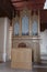 Small compact gothic church organ with three pipe sections installed in rehoused church