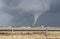 Small cone tornado with debris