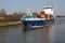 Small container vessel transiting through the kiel canal, germany