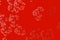 Small coral flowers on red background. Abstract pattern