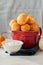 Small cottage cheese doughnuts castgnole in a bowl. White ston