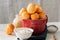 Small cottage cheese doughnuts (castgnole) served on a red bowl