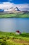 Small cottage in the mountains above the fjord, Iceland