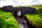 Small creek flowing under a stone bridge