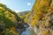 Small creek over colourful rock mountain during autumn season, Hokkaido Japan