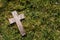 Small cross on grass and moss