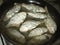 Small crucian carp in flour fried in a pan