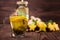 A small cup full of green lemon tea on a dark wooden background. A sweet tea cup next to carambola, ginger and mint. Copy space.