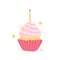 Small cupcake with pink cream decorated with a burning holiday candle. Festive cake for a wedding, birthday, anniversary