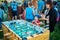 Small curious boy and his mother playing foosball soccer