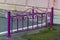 Small detached forged fence of violet color