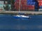 A small dinghy saiiing under power past Blackrock Castle on Lough Mahon