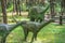 Small diplodocus dinosaurs statues
