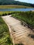 Small dock leading to a mountain lake