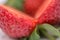 Small dots on the cutted ripe strawberry
