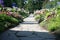 Small driveway lined with beautiful flowers