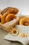 Small dry bagels, small buns on a light background.