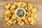 Small dry cookies with pumpkin seeds, bowl with peeled pumpkin seeds on table. Top view