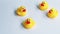 Small ducks yellow made from plastic for children, has a sound for baby playing in bathtub. Funny toy for development the kids.
