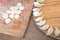 The small dumpling dough is placed on the cutting board and the dumpling is placed on the round tray