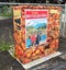 A small electrical transformer booth decorated with photos of fruits and British Columbia symbols.