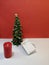 Small elegant Christmas tree with a white ajar gift box