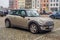Small and elegant grey little Morris Mini Cooper hatchback parked