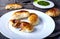 Small empanadas with meat on a white plate