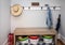 A small entrance mudroom with a hooks for hanging jackets and hats organization which connects the garage to the house