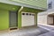 Small entrance porch and garage door of duplex house.