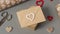 Small envelope with a heart over a valentine`s day gift
