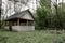 Small European-style resort wooden house or wooden hut in forest Old wooden house. Old wood in the countryside. Near is beautiful