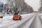 Small excavator bobcat working on the street